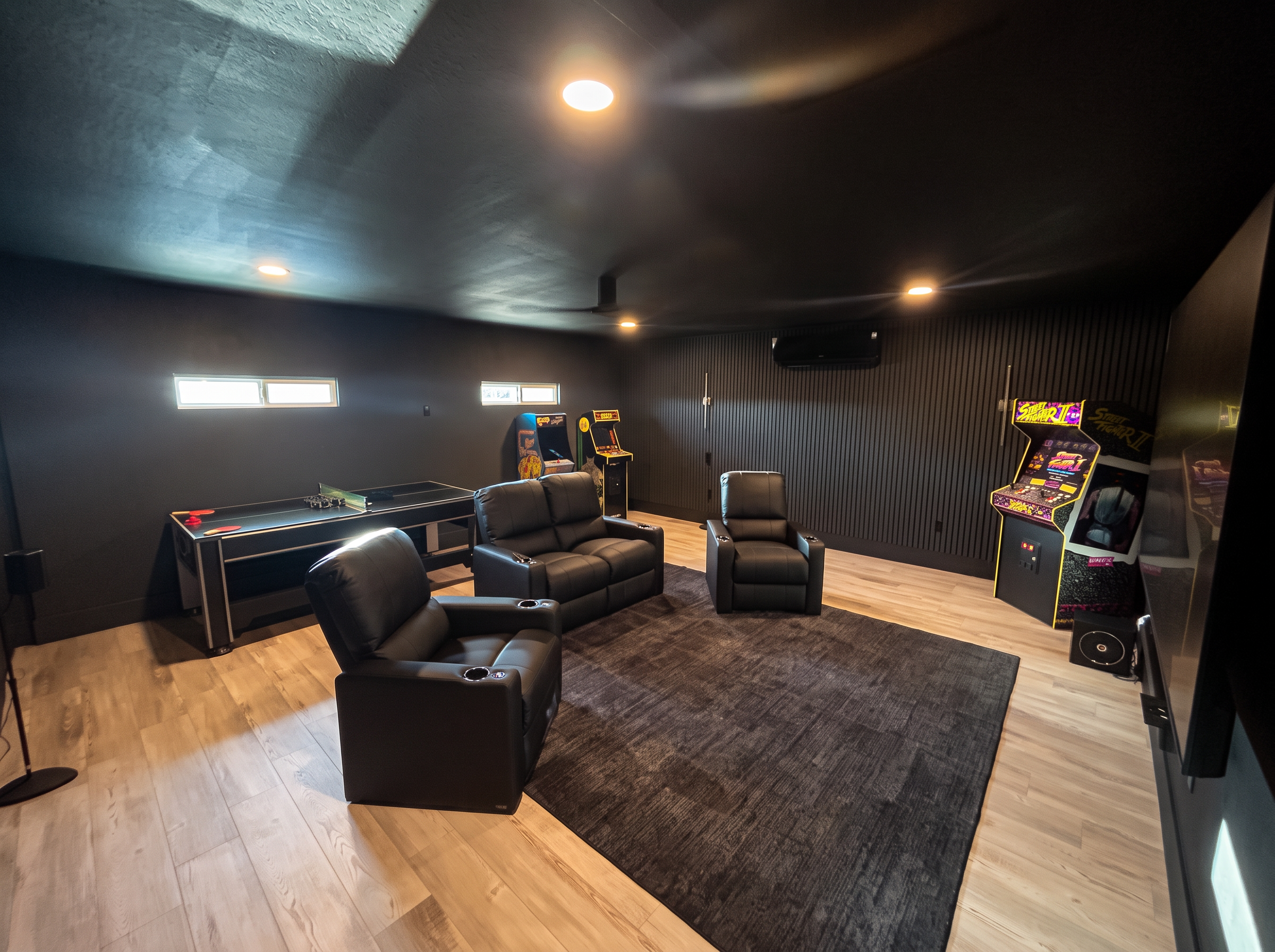 Game room with arcade games and group seating