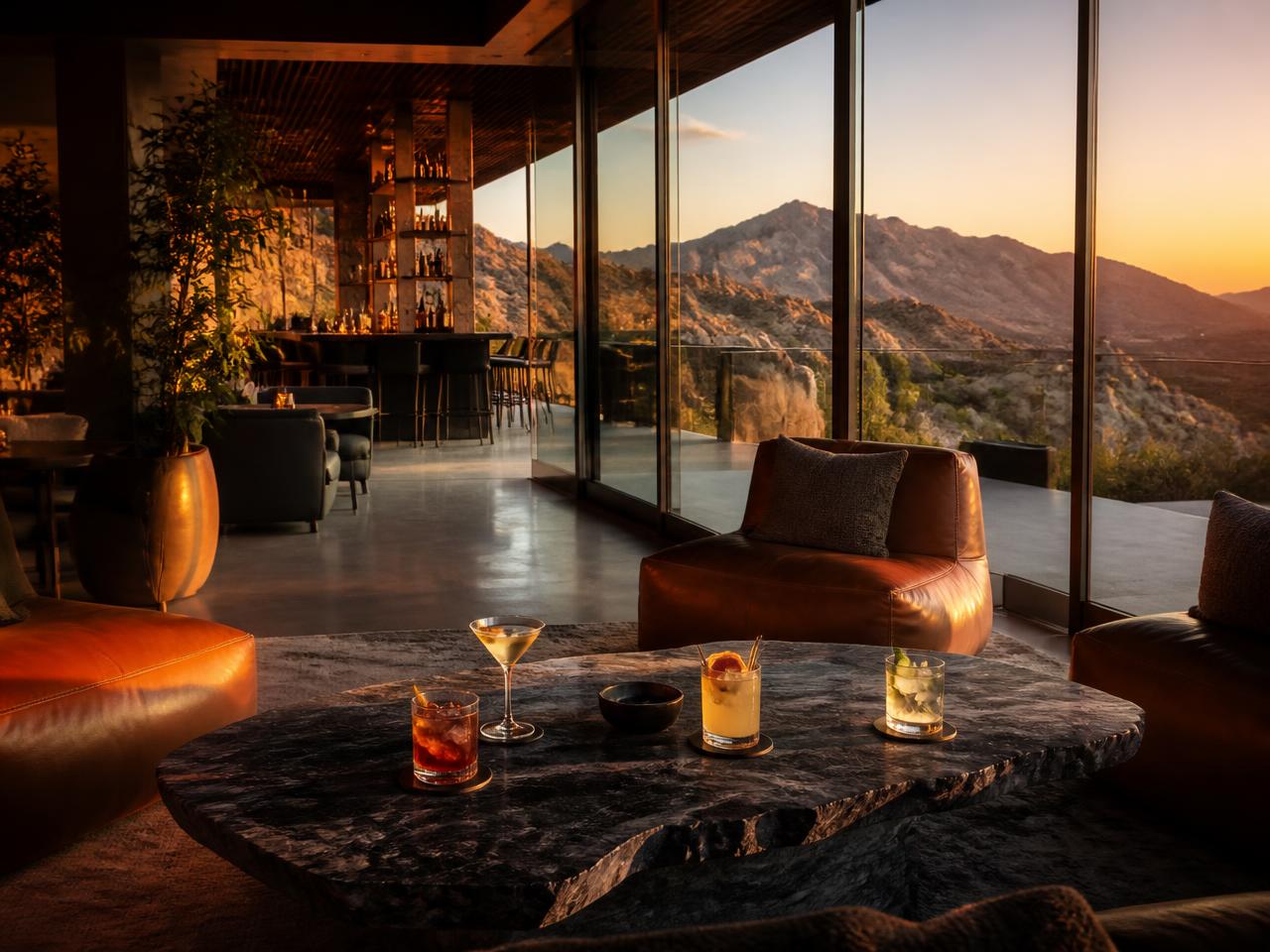 Mountainside resort lounge with desert views at golden hour